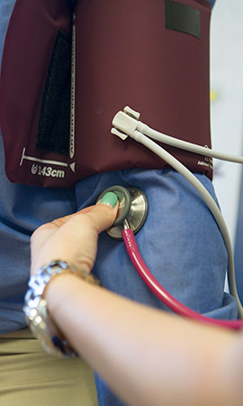 nurse taking pulse